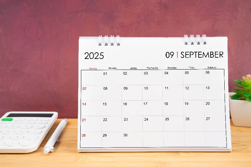 September 2025 white calendar can calculator with pen