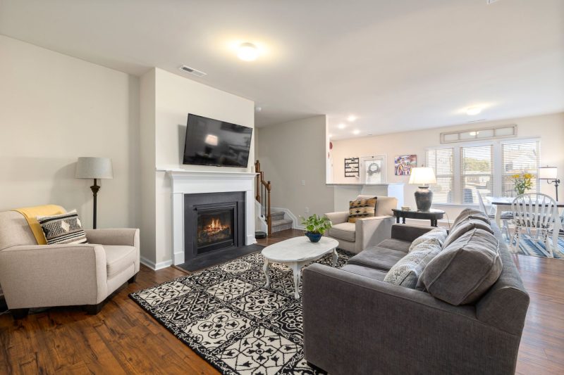 Home 10 Spacious living room featuring a fireplace TV and comfortabl 1790701286